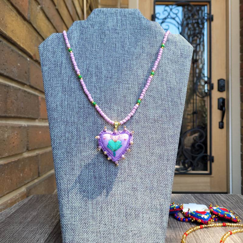 Purple sagrado corazon necklace